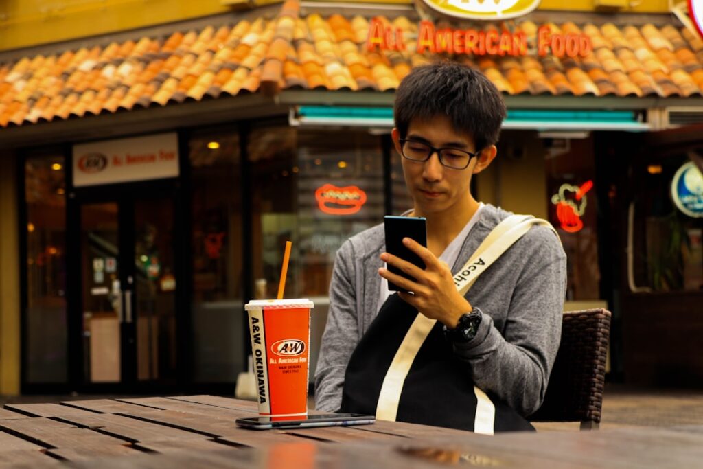 japanese man smartphone cafe