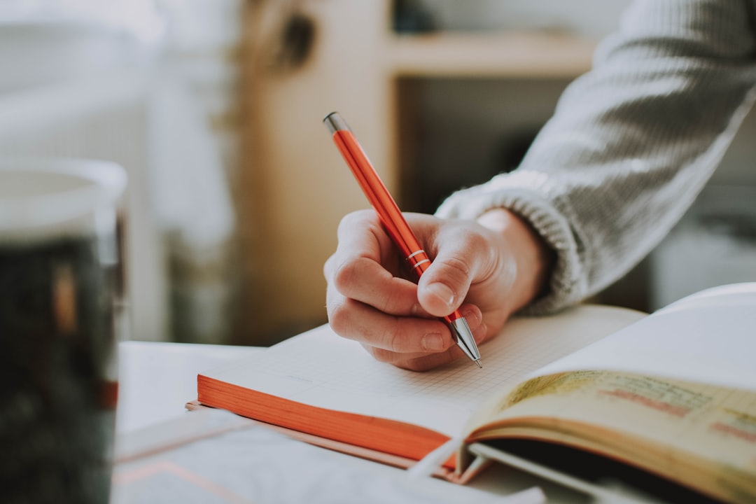 woman writing notebook decision