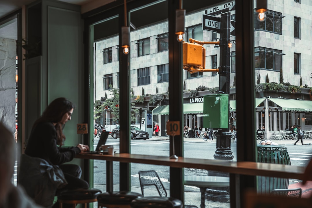 couple talking coffee shop window