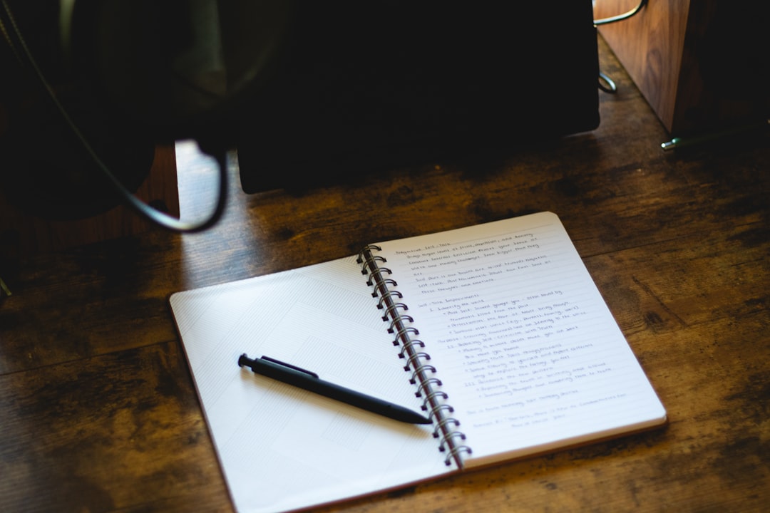 checklist notebook pen desk