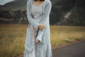 woman outfit pastel dress cardigan