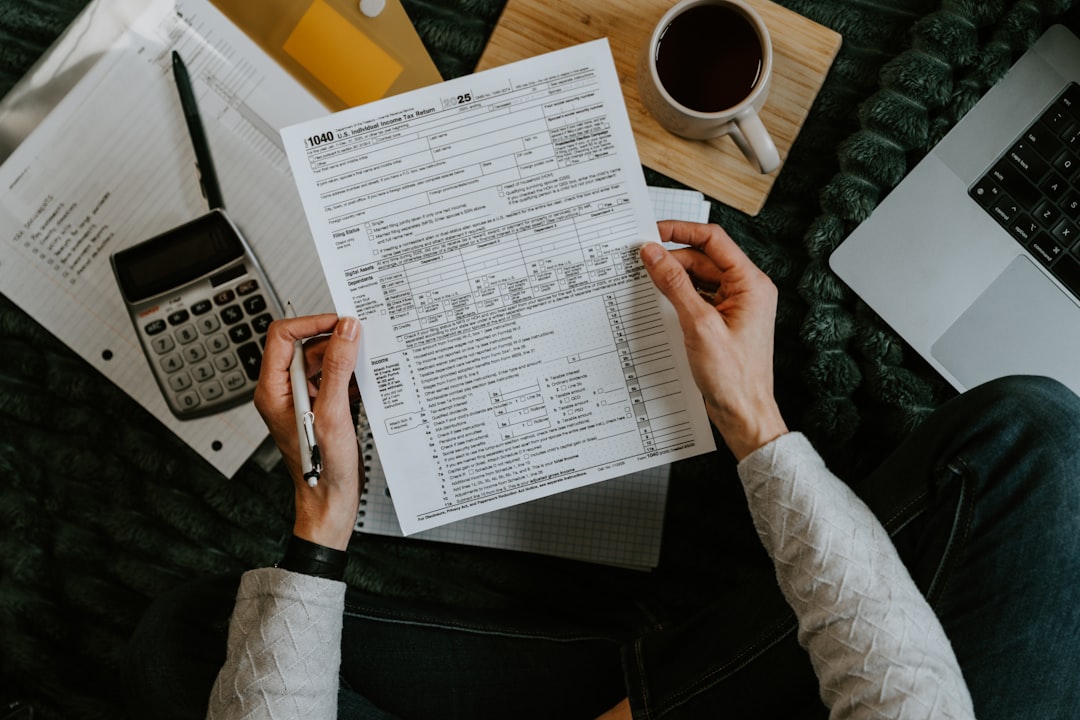 young woman calculating budget desk