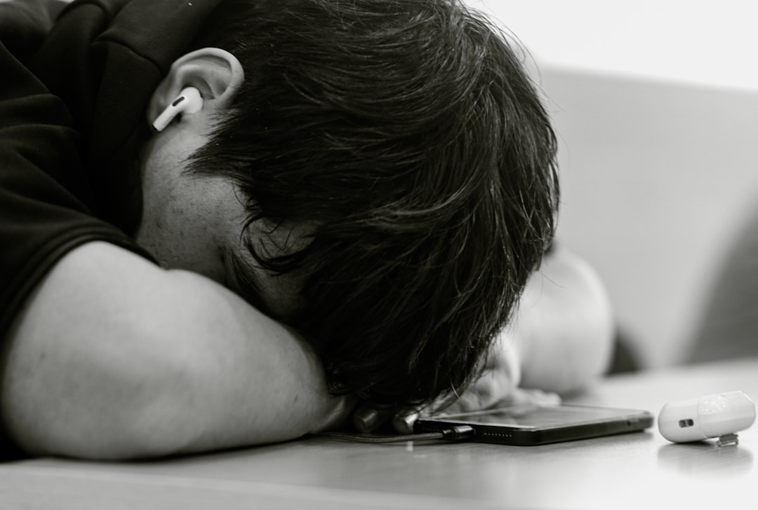 person tired smartphone