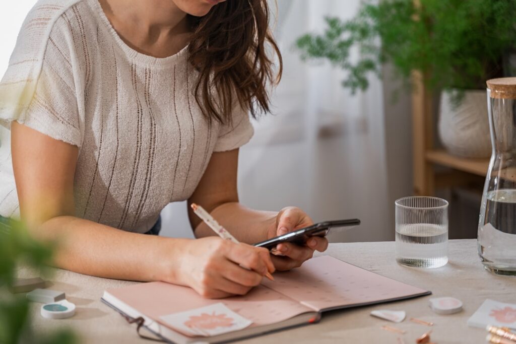 young woman calculating wedding budget with calculator
