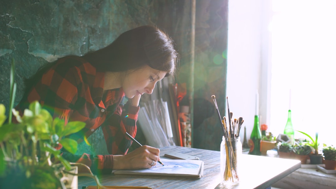 young woman writing notebook plan
