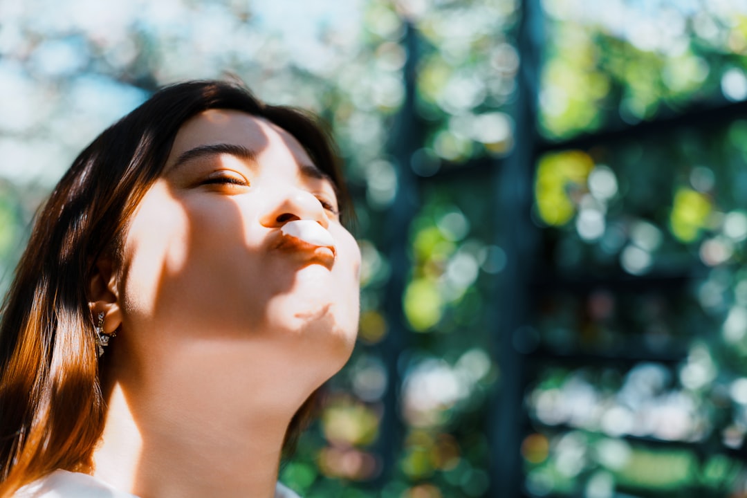 woman taking selfie outdoor sunlight