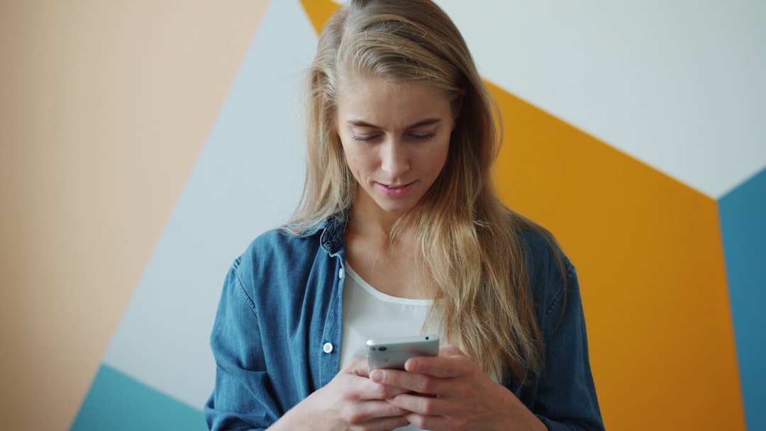 young woman comparing apps phone