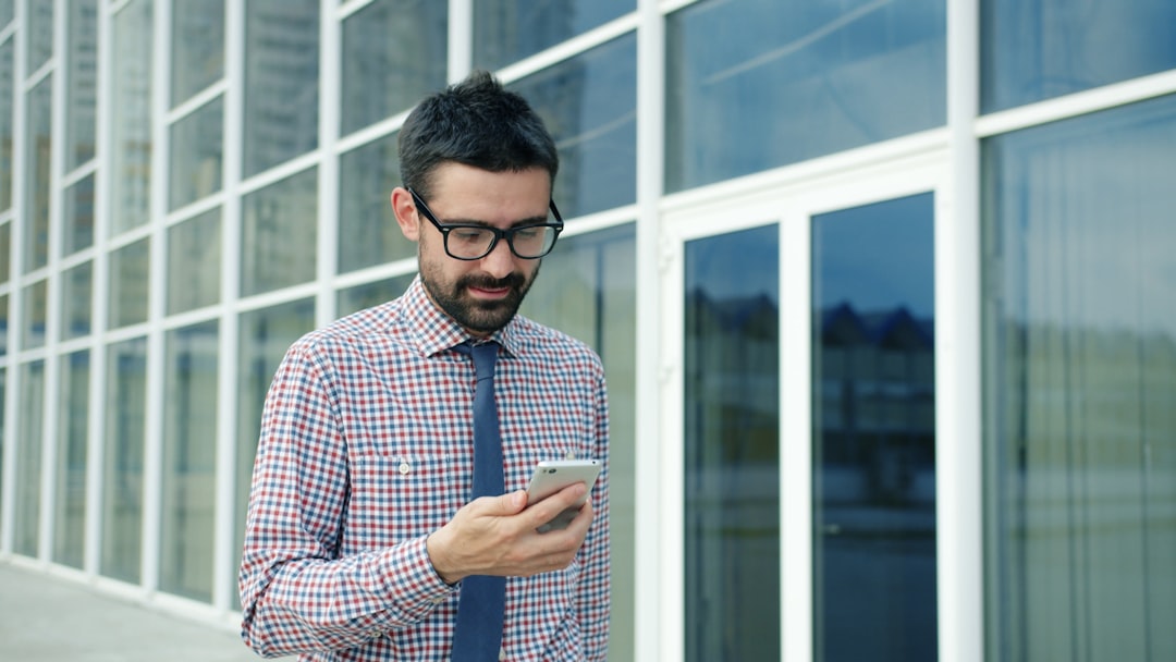 confident man texting outdoor