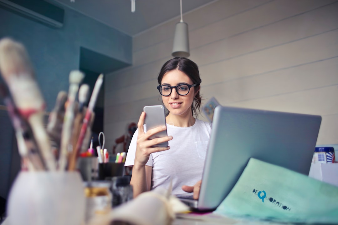 woman checking phone budget