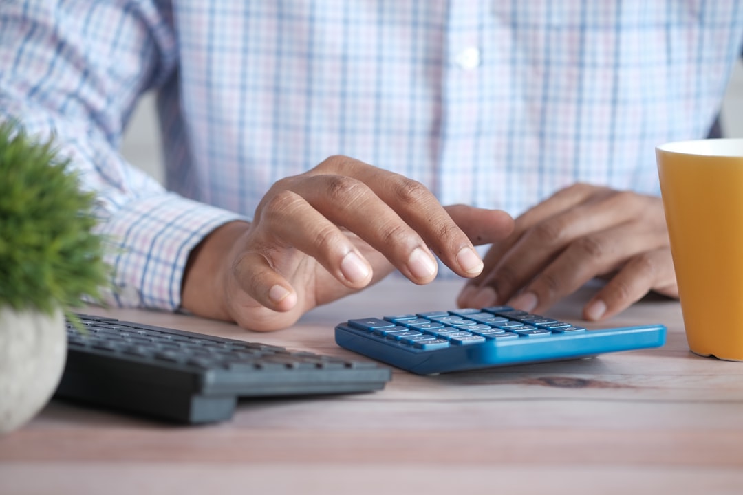 japanese woman calculating budget calculator