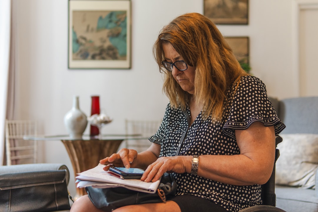 woman calculating budget notebook