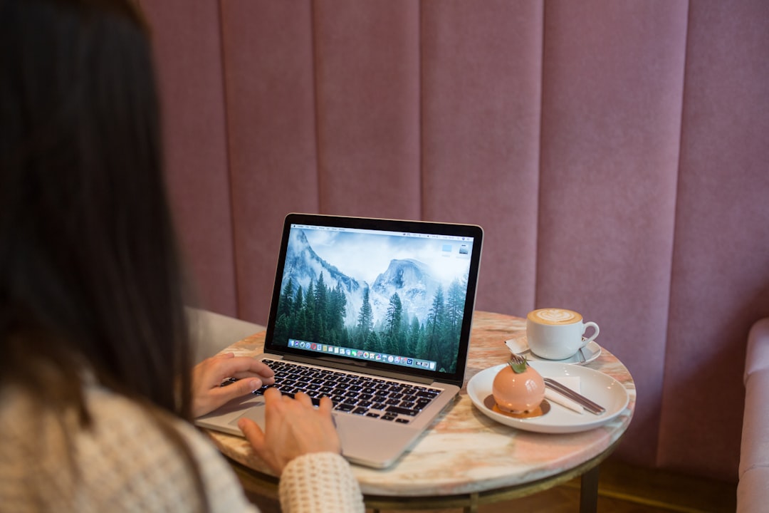 japanese woman thinking laptop cafe