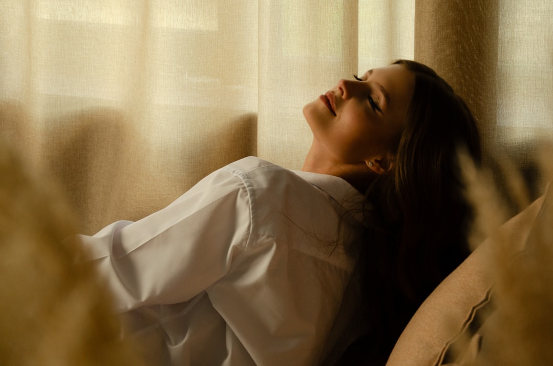 woman relaxing window light