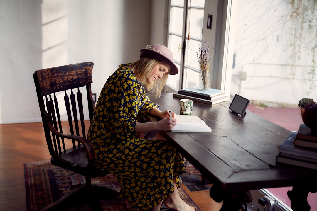 woman writing message thoughtful