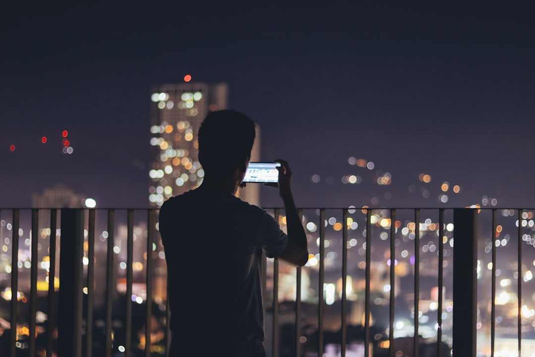 businessman smartphone night city