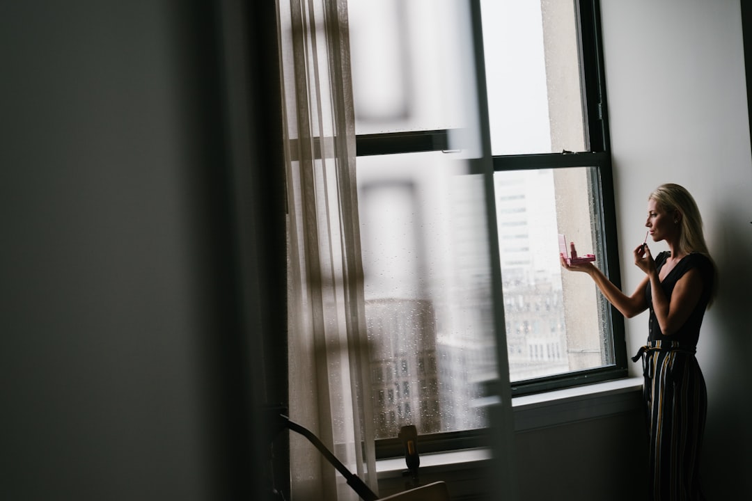 woman phone call window light