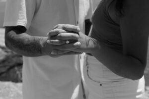 couple holding hands serious talk