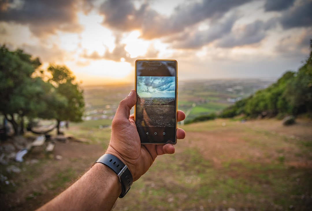 person reflecting smartphone