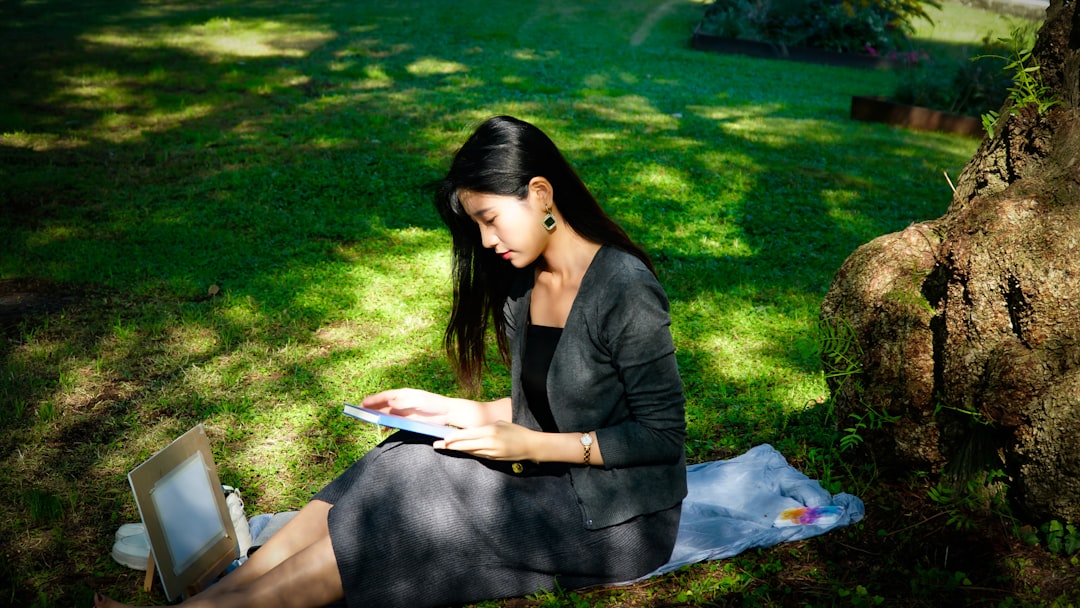 woman writing profile laptop natural light