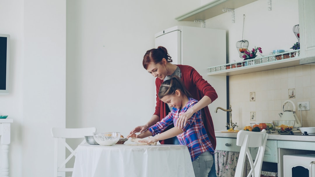 father son cooking kitchen