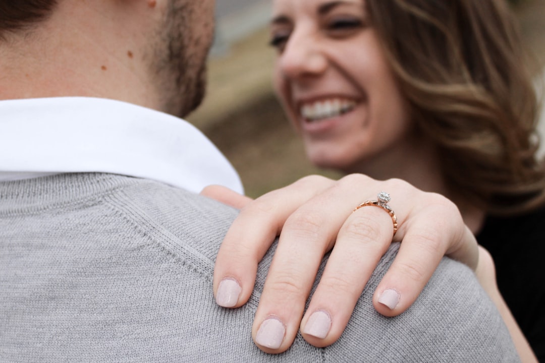 happy young couple engagement ring