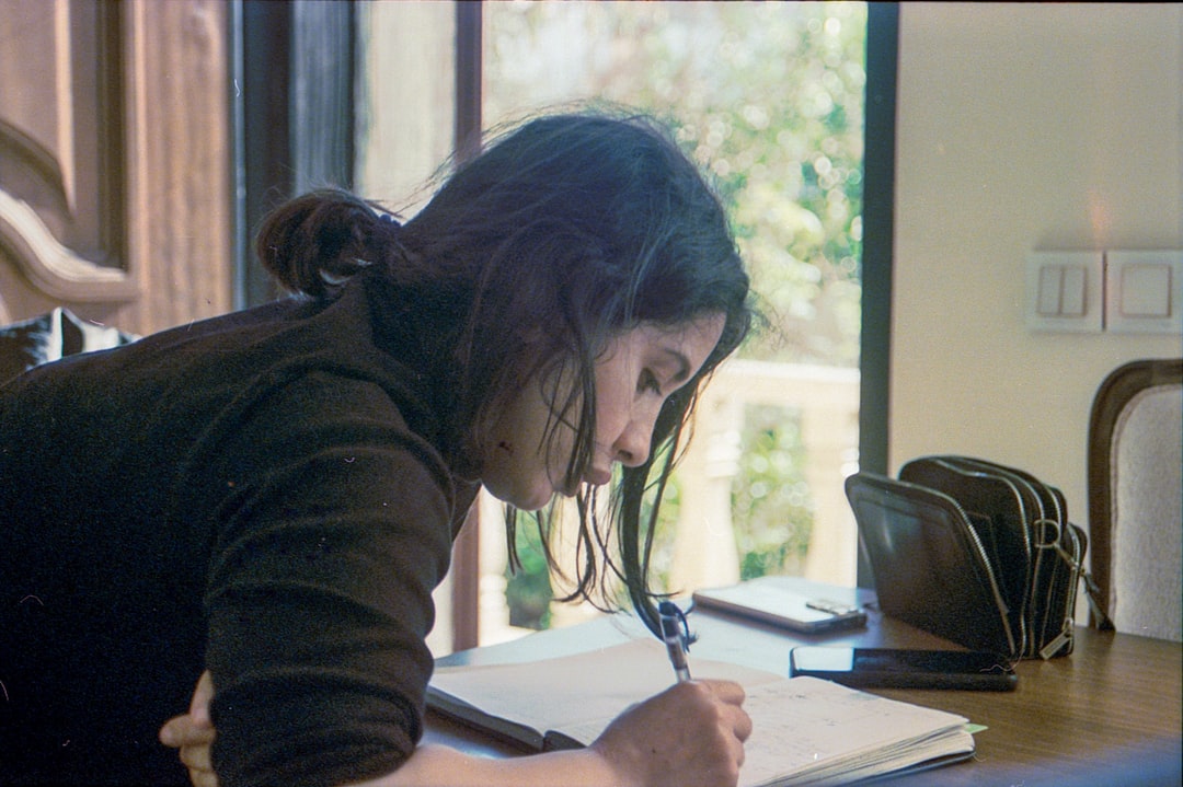 japanese woman writing diary at home