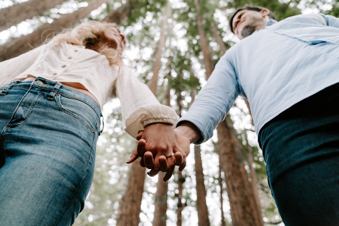 happy couple holding hands park