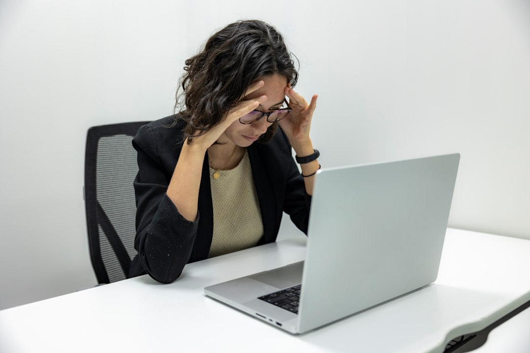 woman thinking laptop disappointed