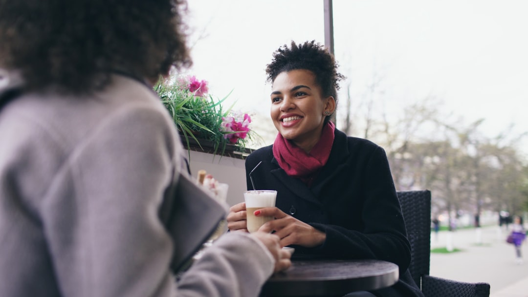 two people talking smile cafe interview