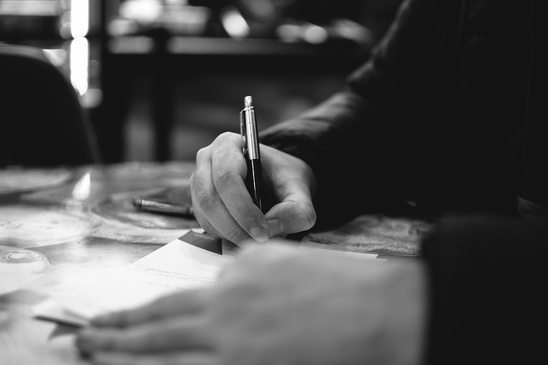 woman writing profile card pen