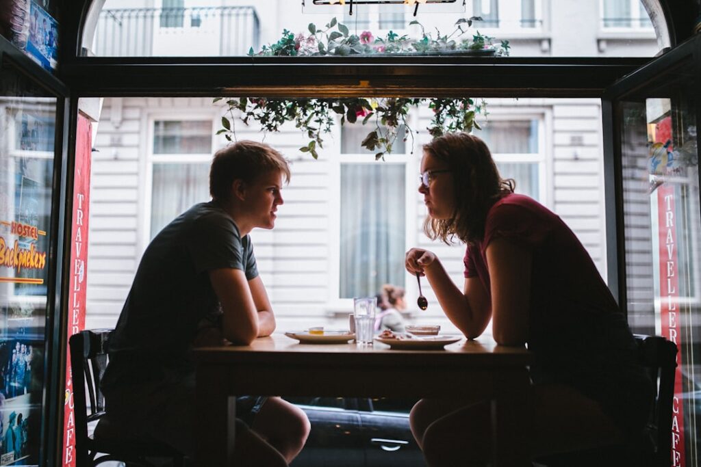 couple serious conversation cafe relationship
