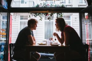couple serious conversation cafe relationship