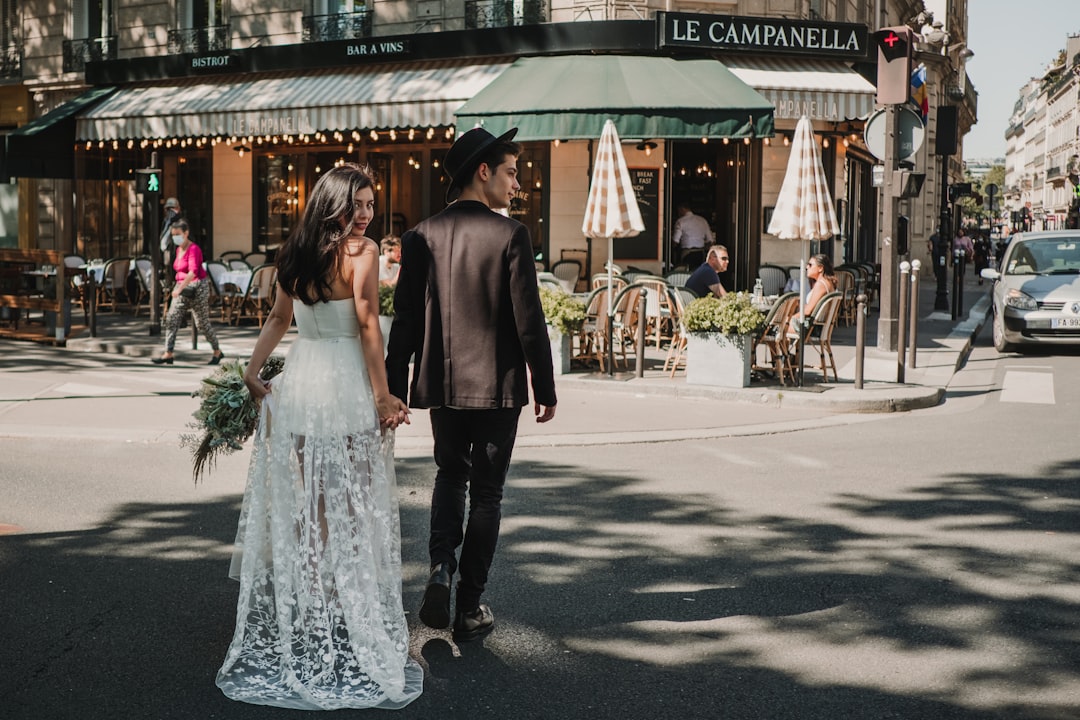 couple holding hands cafe