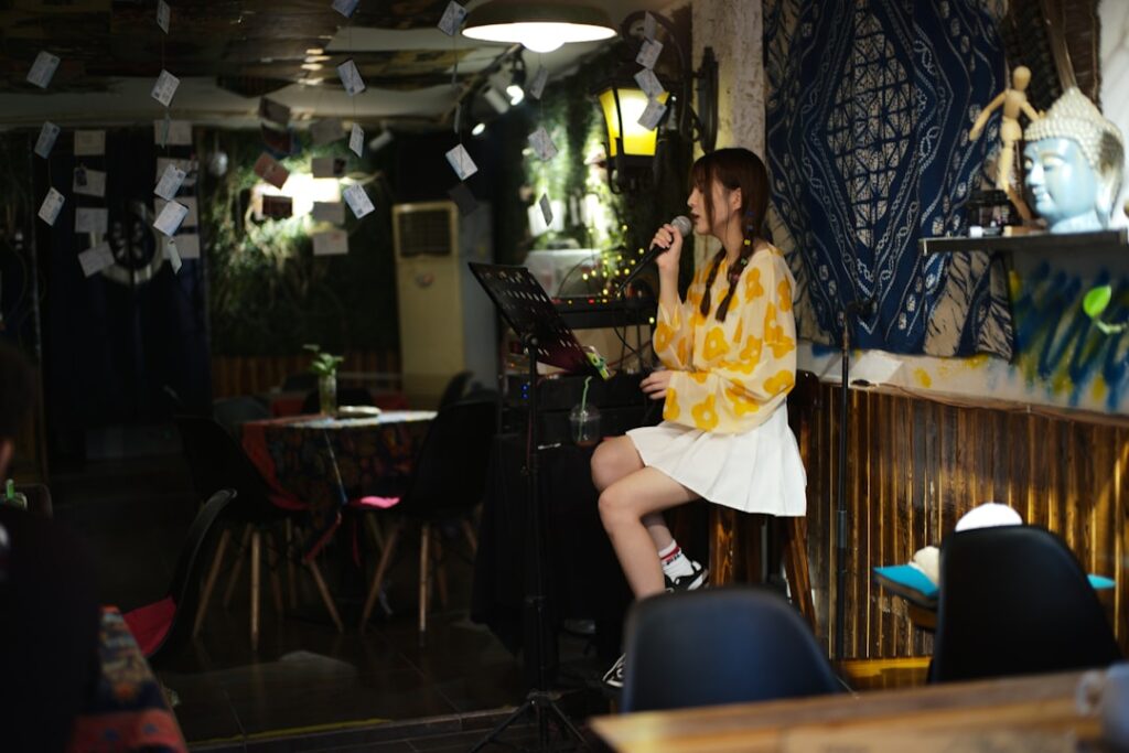 japanese woman reading smartphone at night cafe