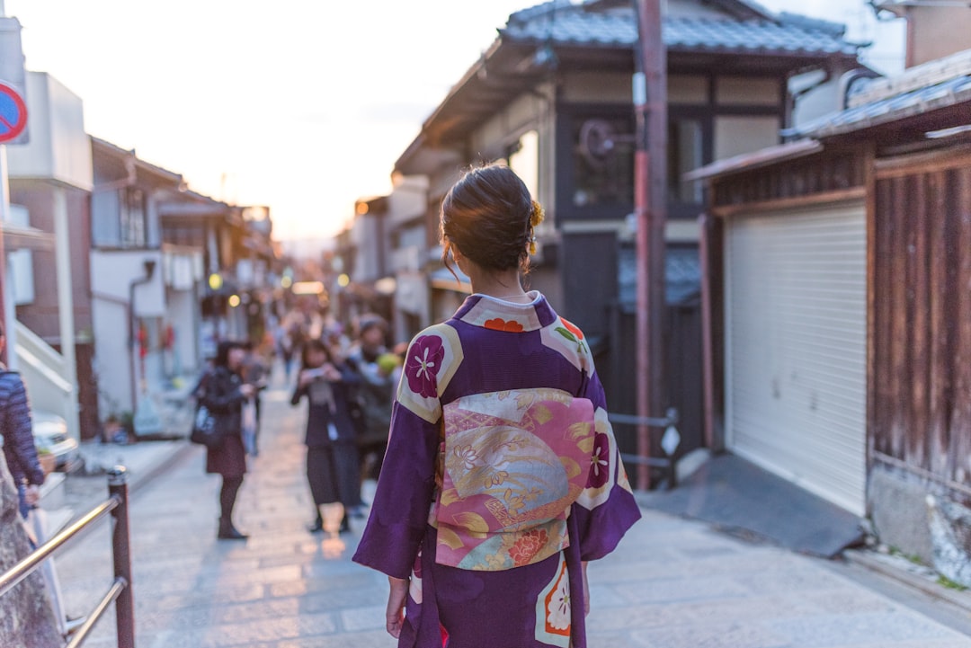 woman walking street confident sunlight japan