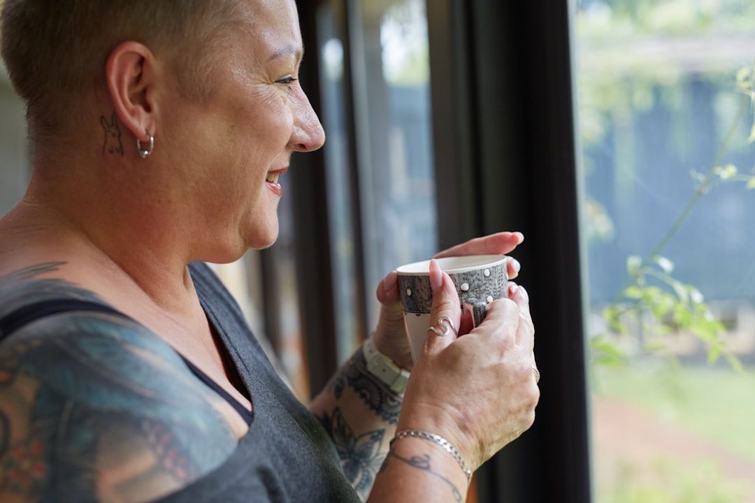 smiling mature woman coffee window