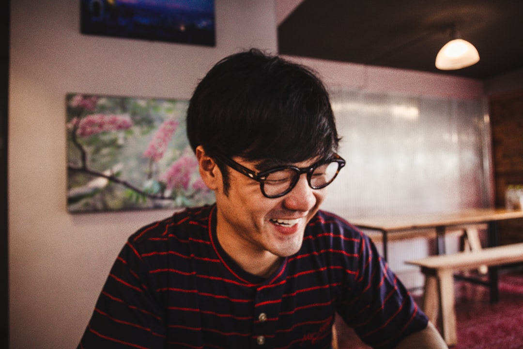 japanese man smiling cafe portrait