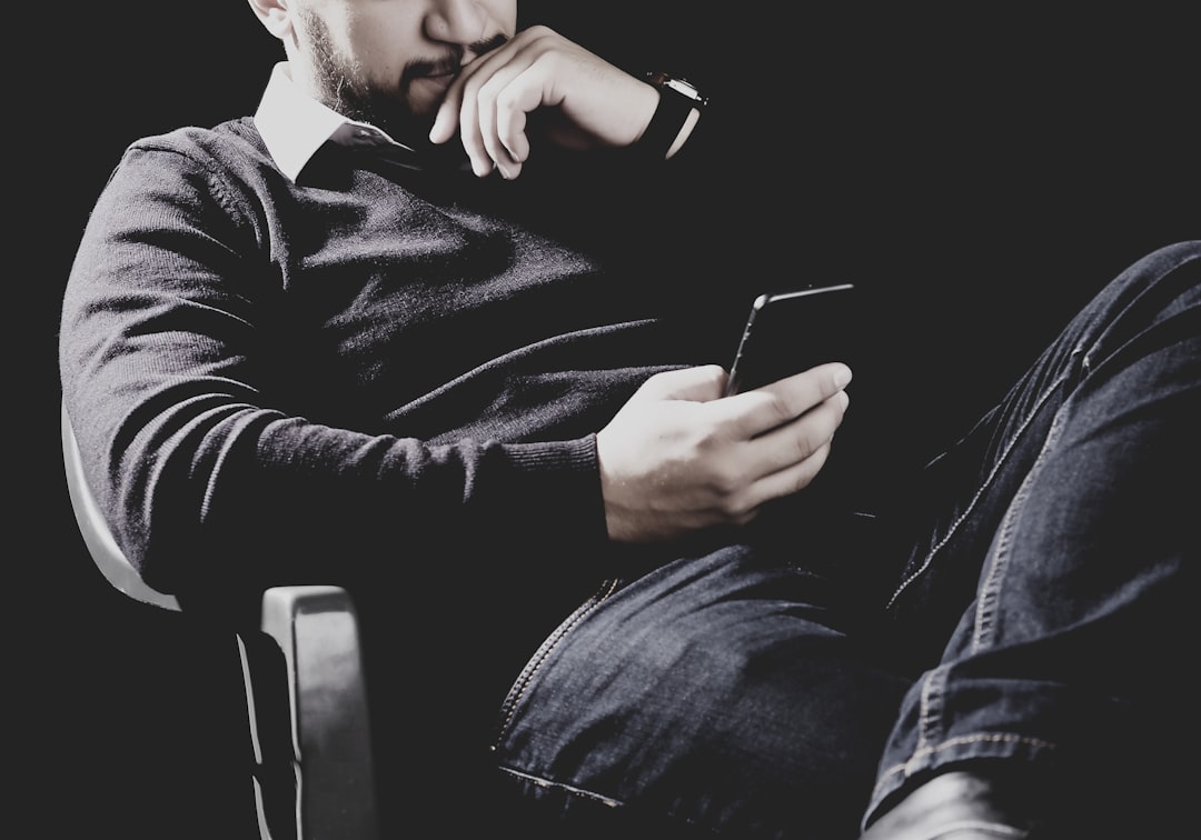 man thinking smartphone