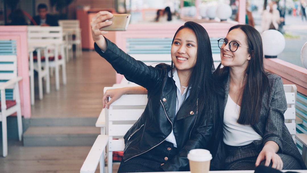 young woman cafe smartphone