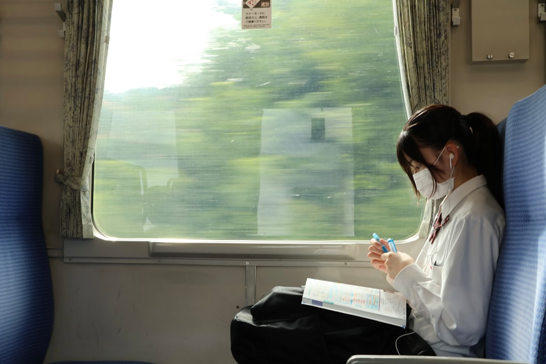 japanese woman smartphone night train