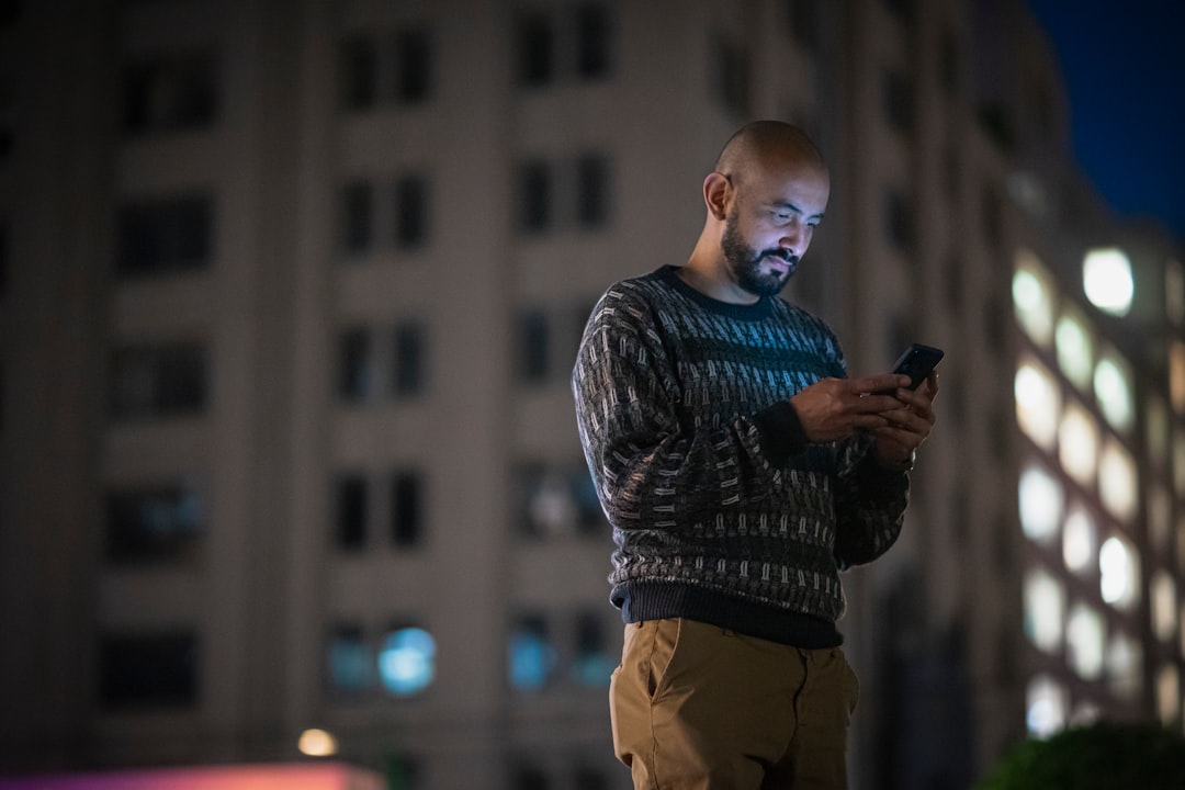 businessman thirties smartphone city