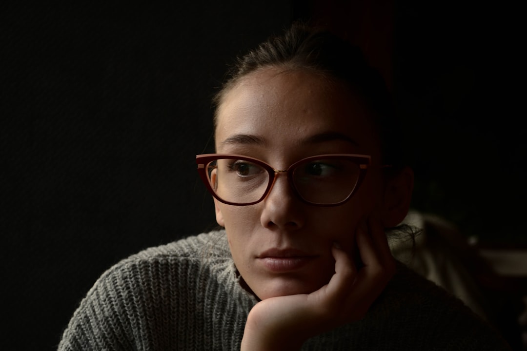 regret thinking woman dark room