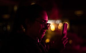 smartphone dating app woman profile pink