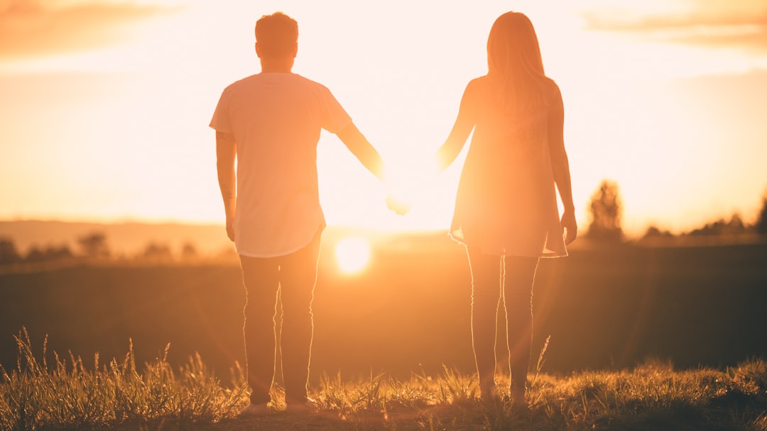 couple holding hands outdoor