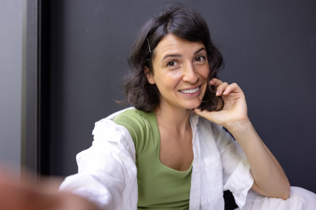 middle aged woman smiling smartphone