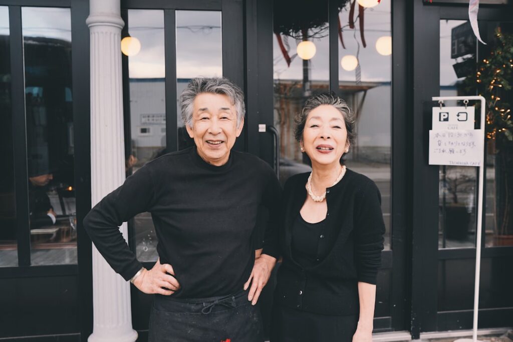 middle aged japanese couple smiling cafe