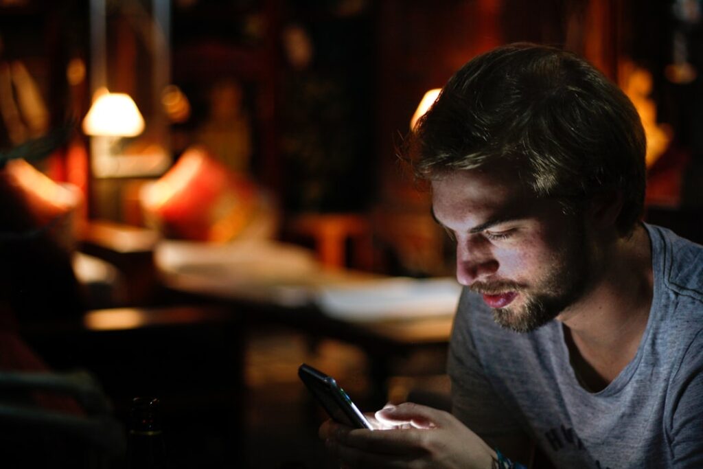 mature man smartphone evening