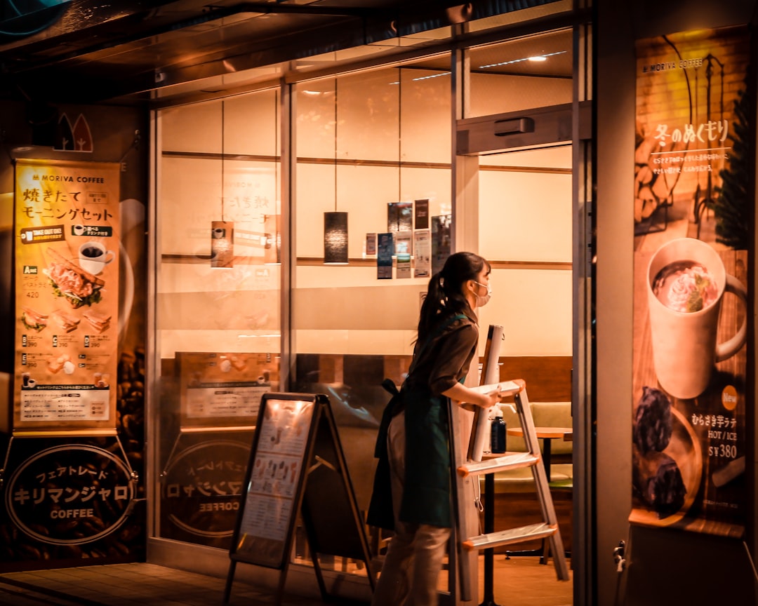 young japanese woman coffee shop smartphone