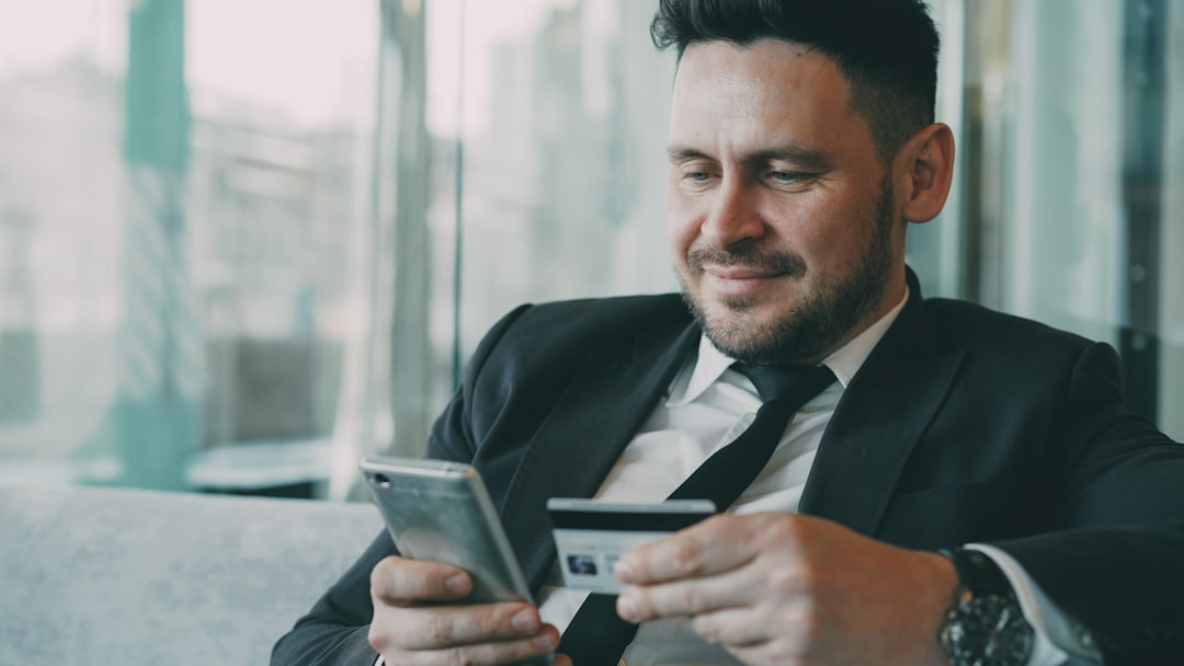 businessman thinking smartphone payment