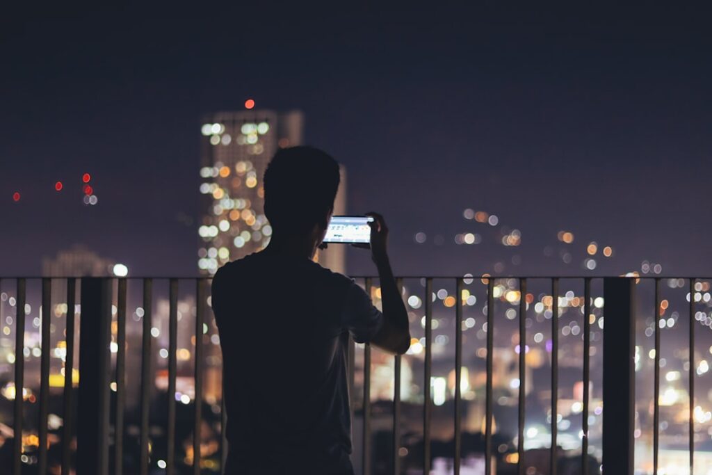 young japanese businessman smartphone city night